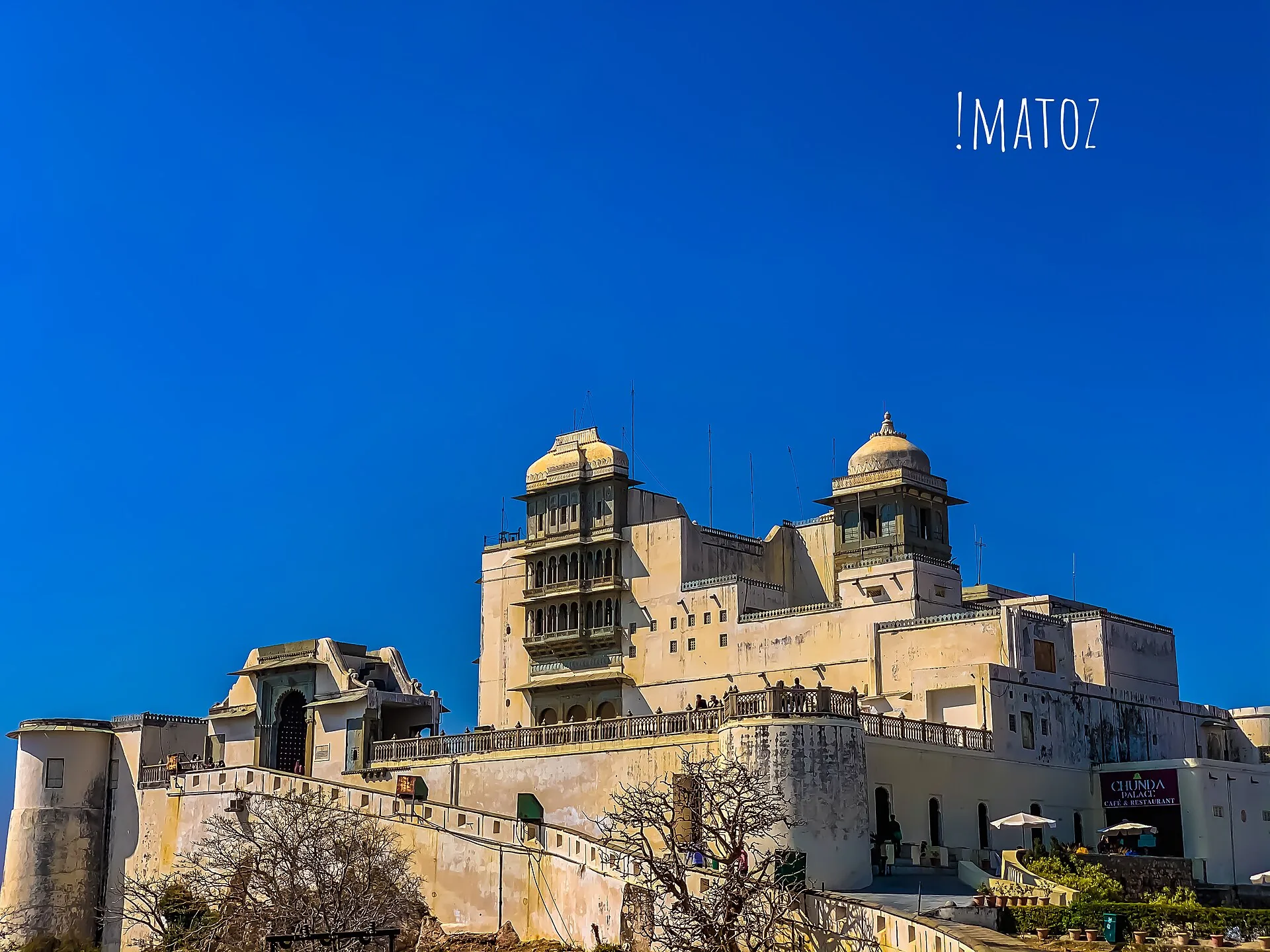 Sajjangarh Monsoon Palace rising above its stone walls
