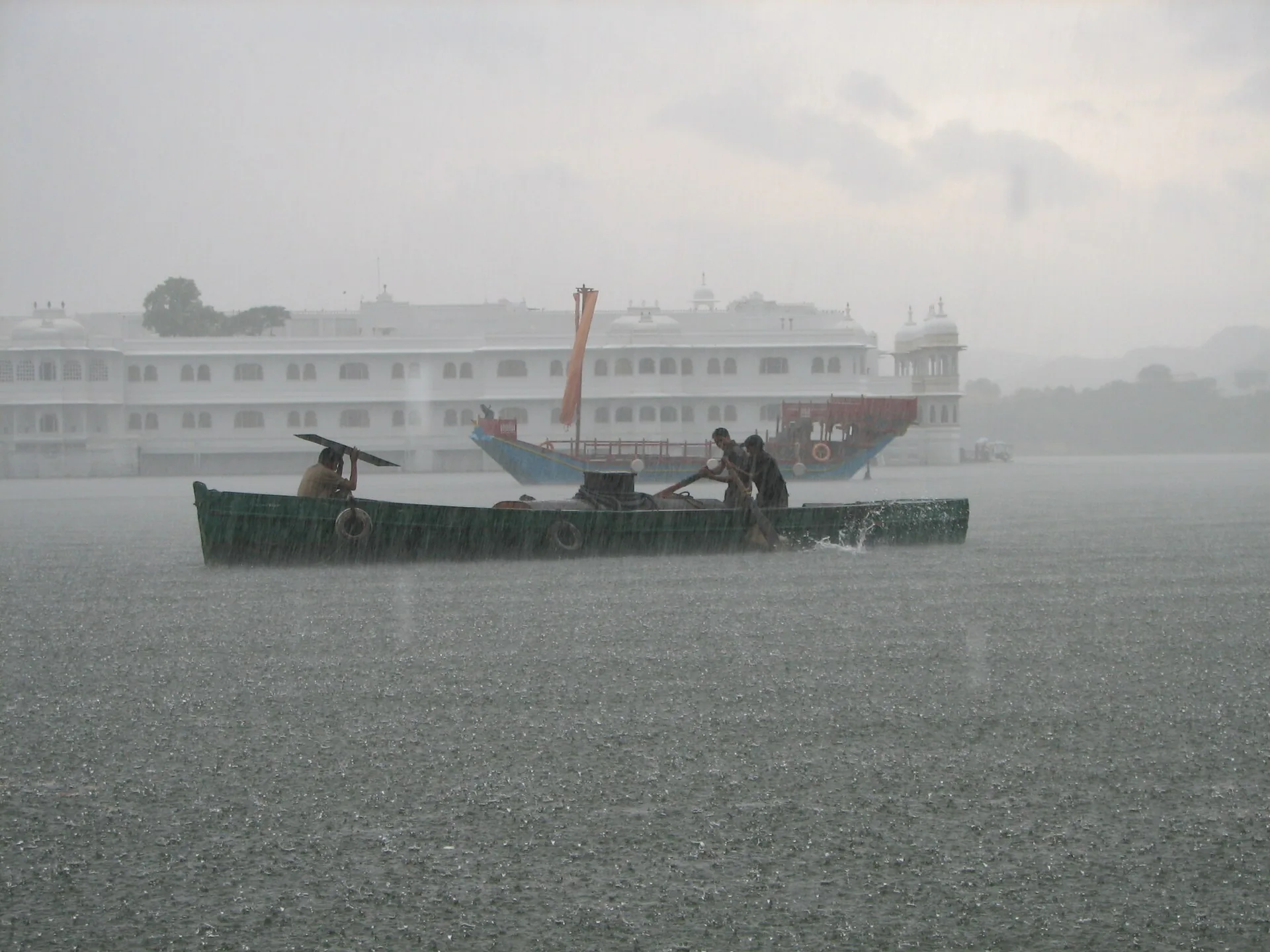 A boat on Lake Pichola during monsoon rain