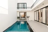 Calisto: Private pool framed by courtyard arches