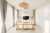 Calisto: Wooden console beside light-filled curtains