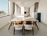 Calisto: Dining table opening onto the living area