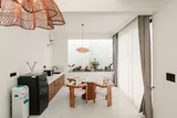 Elara: Dining room and kitchenette with woven pendant lights